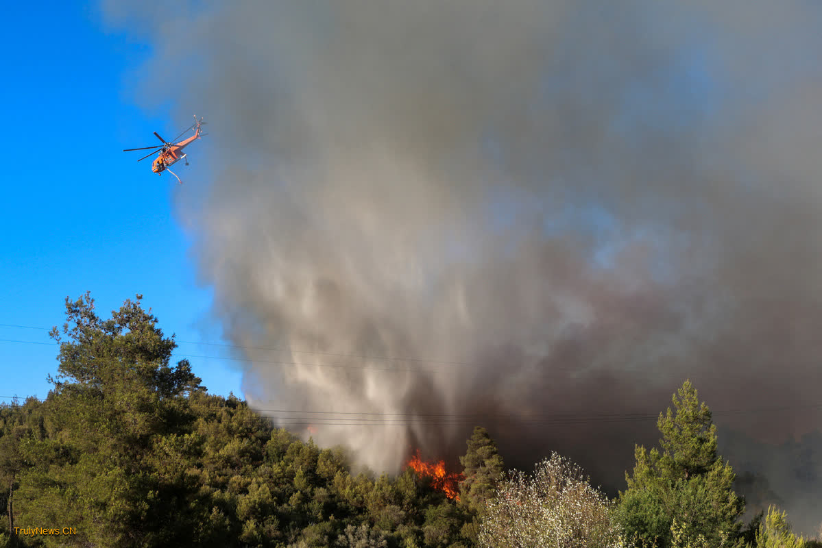 1 dead as Greek firefighters battle major wildfires near Athens