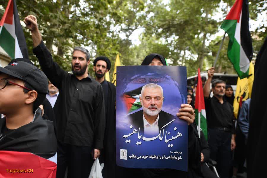 Mournful Iranians bid final farewell to Hamas chief, vow revenge